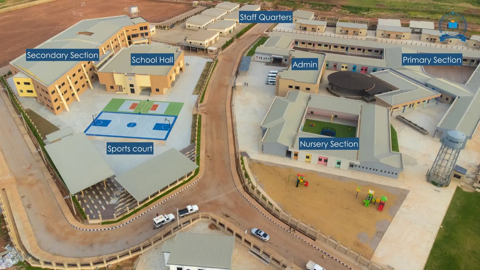 Aerial overview of Blue Horizon Schools showing the nursery, primary and secondary sections, administration, school hall, sports court and staff quarters